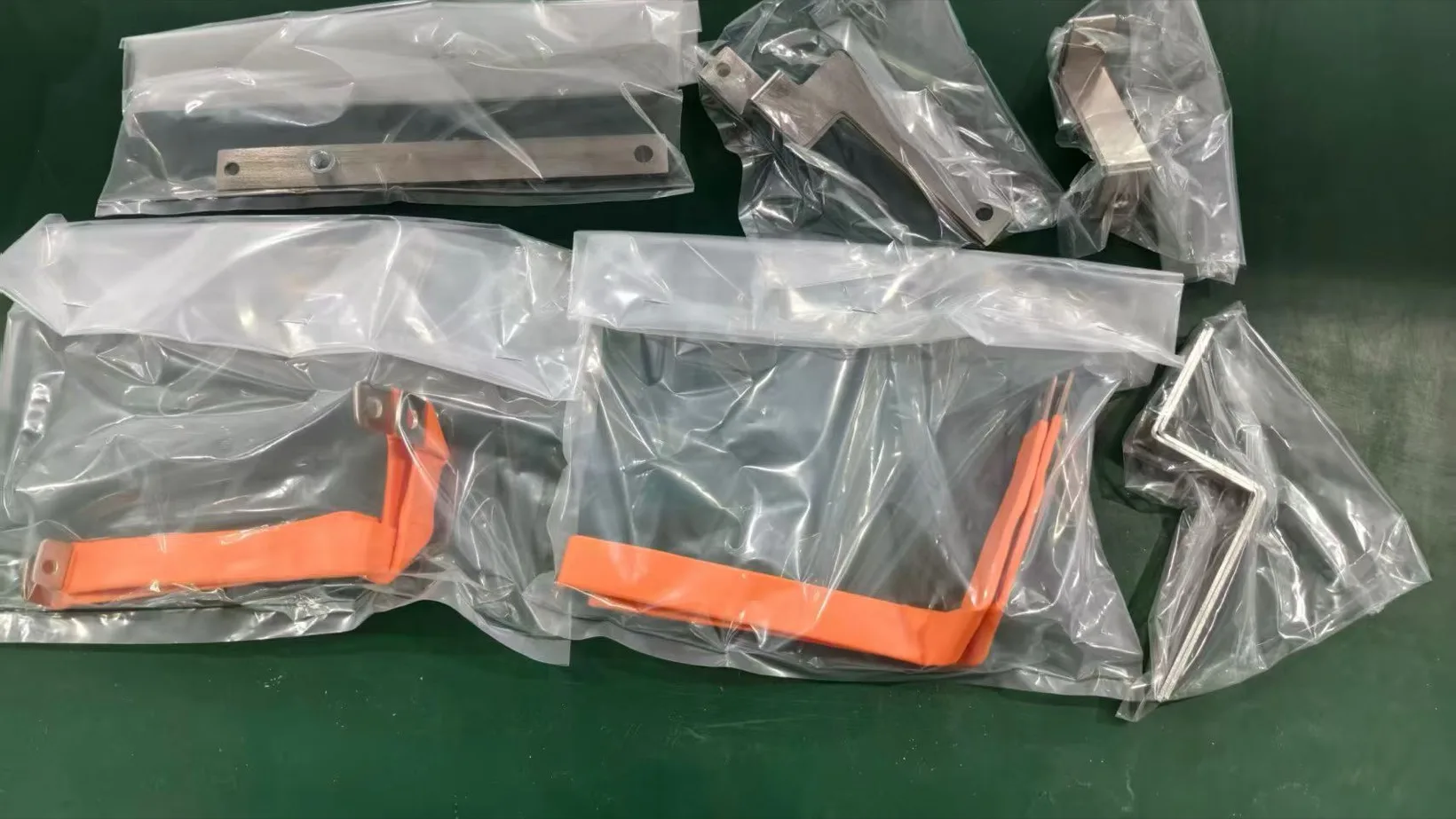 Sample kit of copper busbars with bare, black and orange insulated finishes in bags